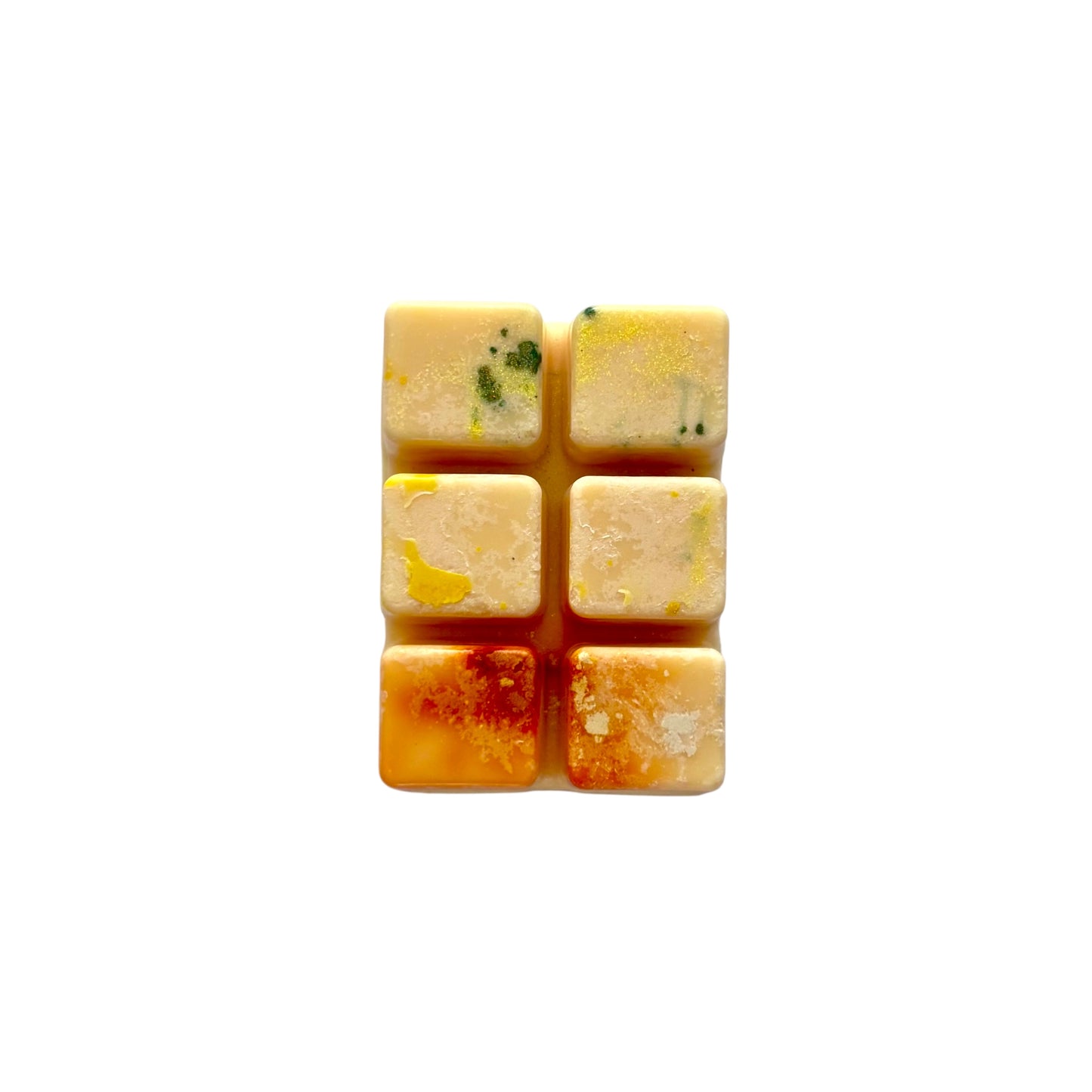 A yellow orange colored wax melt with 6 cubed sections