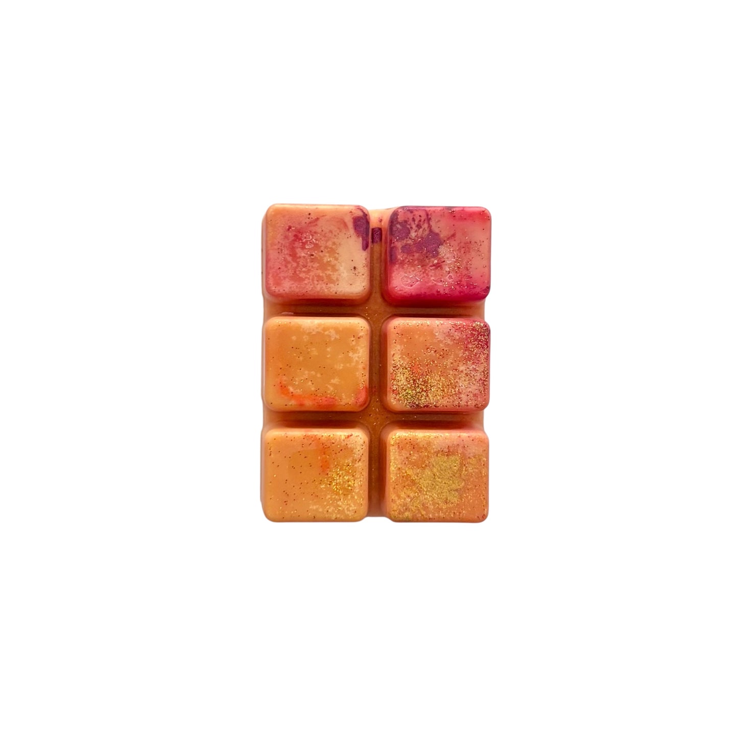 An orange colored wax melt with 6 cubed sections