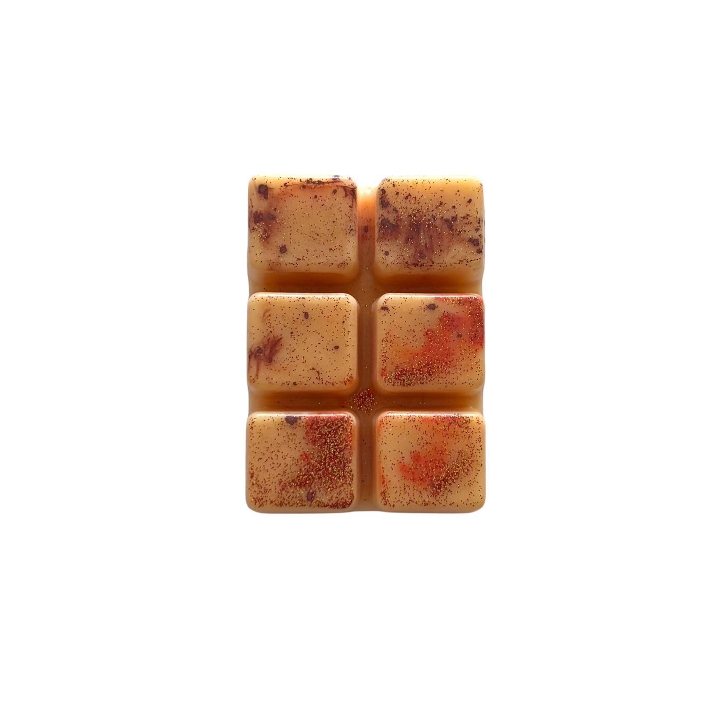 An orange colored wax melt with 6 cubed sections
