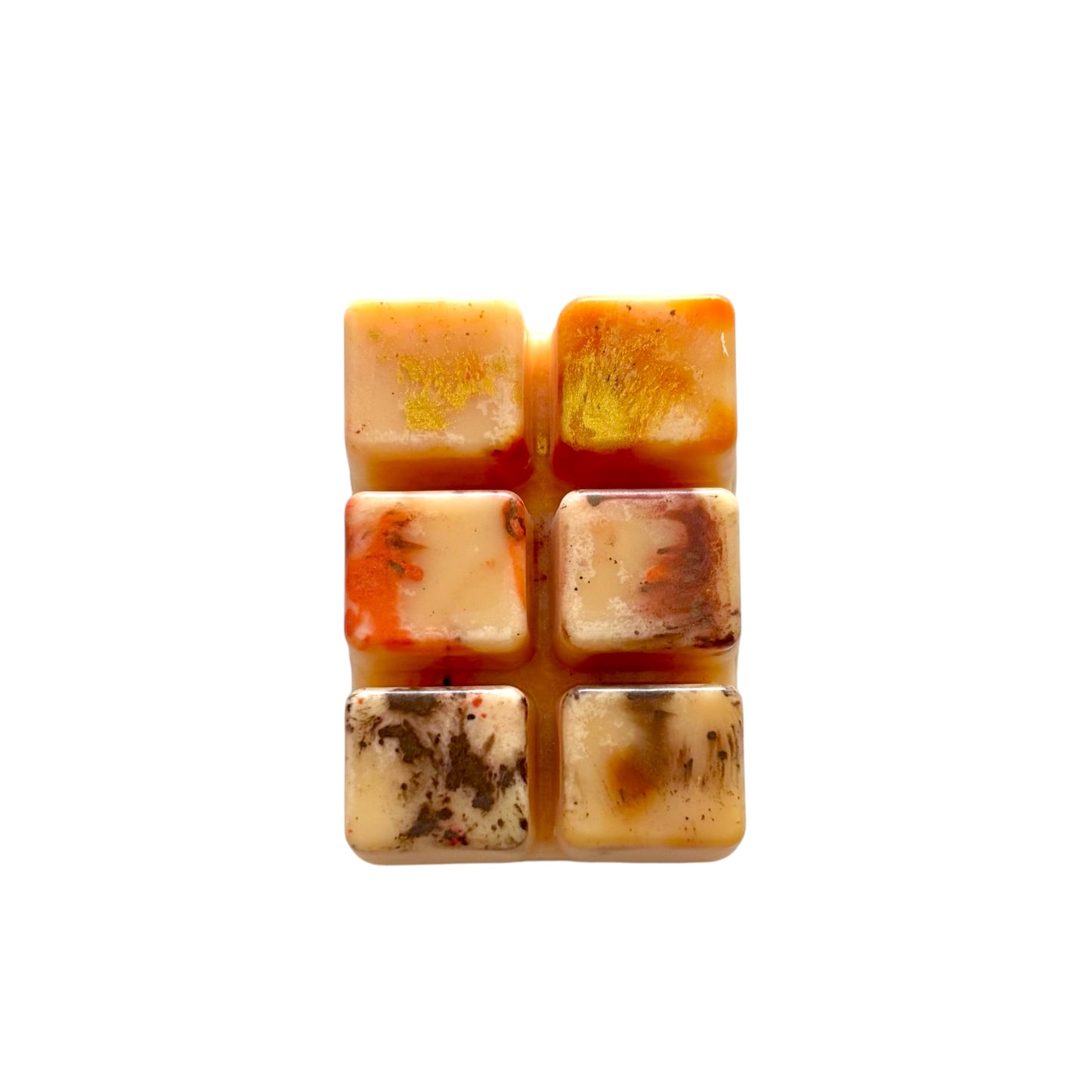 An orange colored wax melt with 6 cubed sections